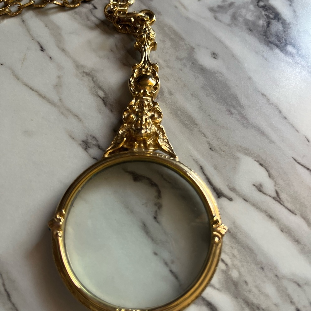 Joan Rivers Magnifying Cherub necklace